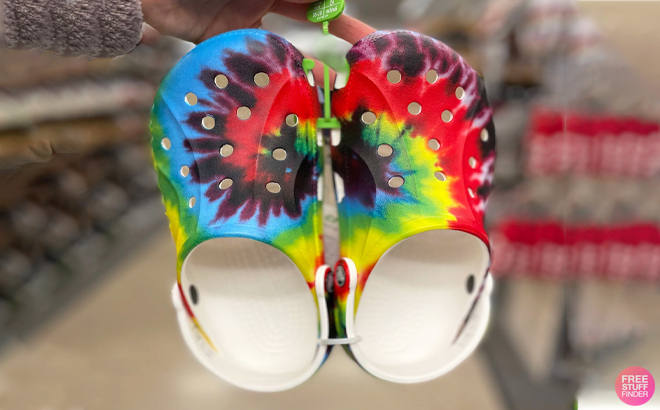 A Person Holding the Crocs Toddler Tie Dye Clogs