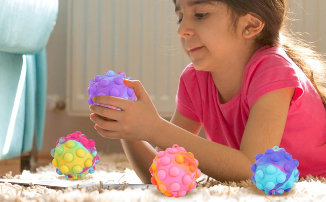 A Child Playing with the Pop Fidget Toys