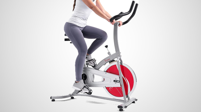 A person using a Sunny Health Fitness Exercise Bike