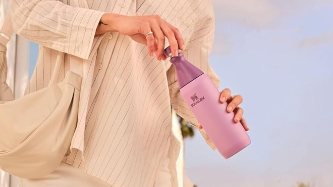 A Woman Holding Stanley All Day Slim Bottle