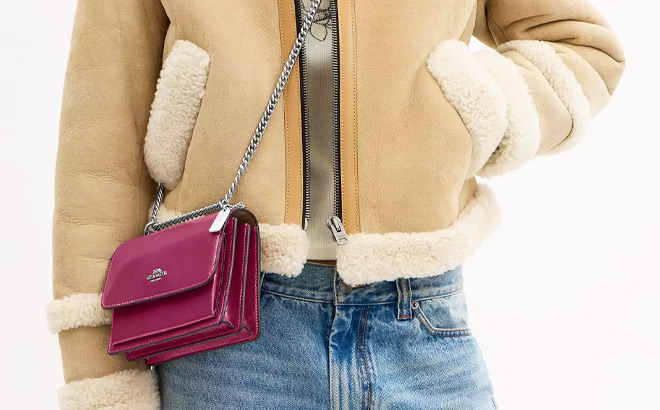 A Person Wearing Coach Outlet Mini Klare Crossbody Bag