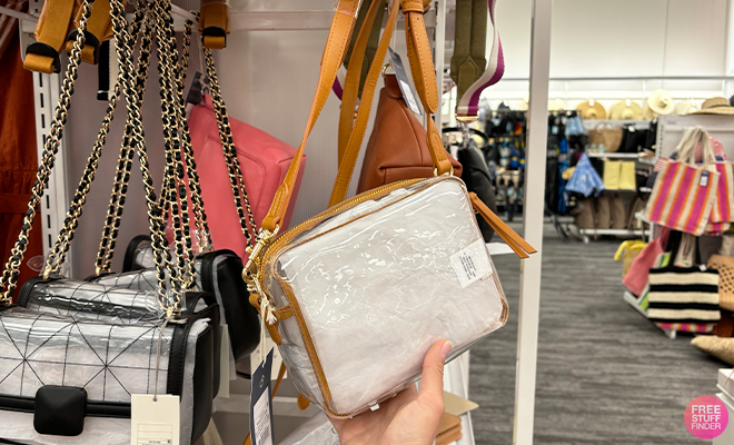 A Persong Holding the Universal Thread Camera Crossbody Bag at Target